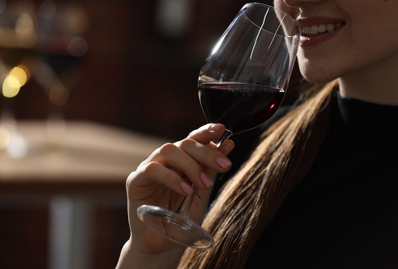 Wine tasting Girl drinking a glass of red wine