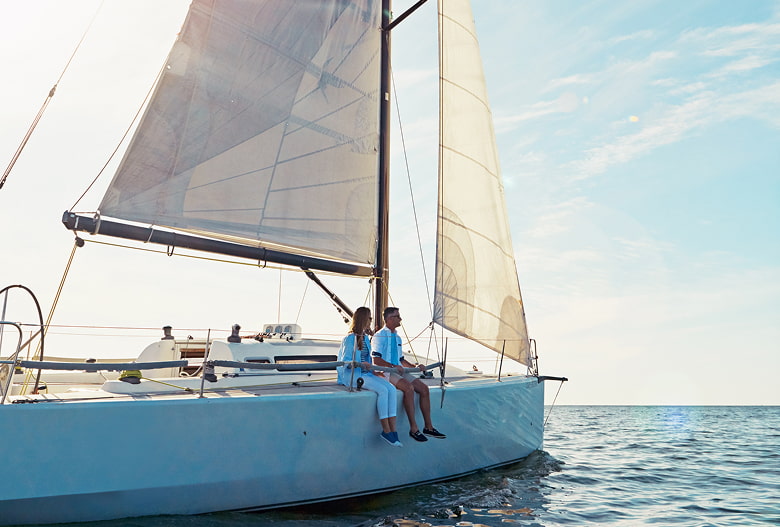 Boat trip Couple sitting on a sailing boat