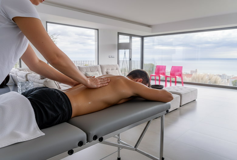 Professional massage Massage table with person receiving a massage
