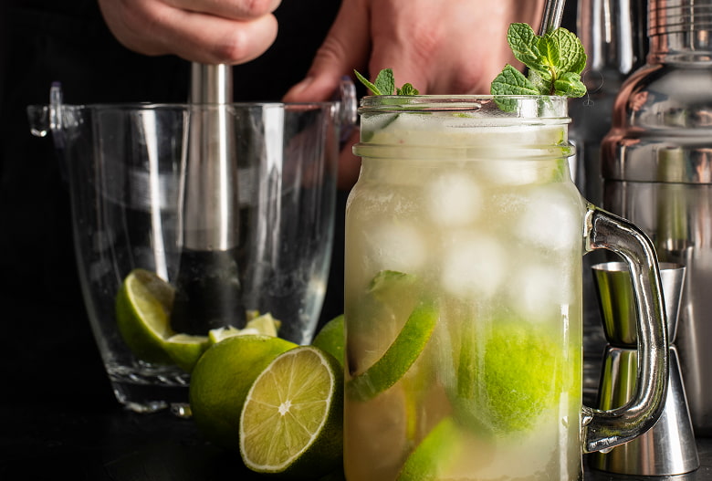 Professional cocktails Hands making a mojito