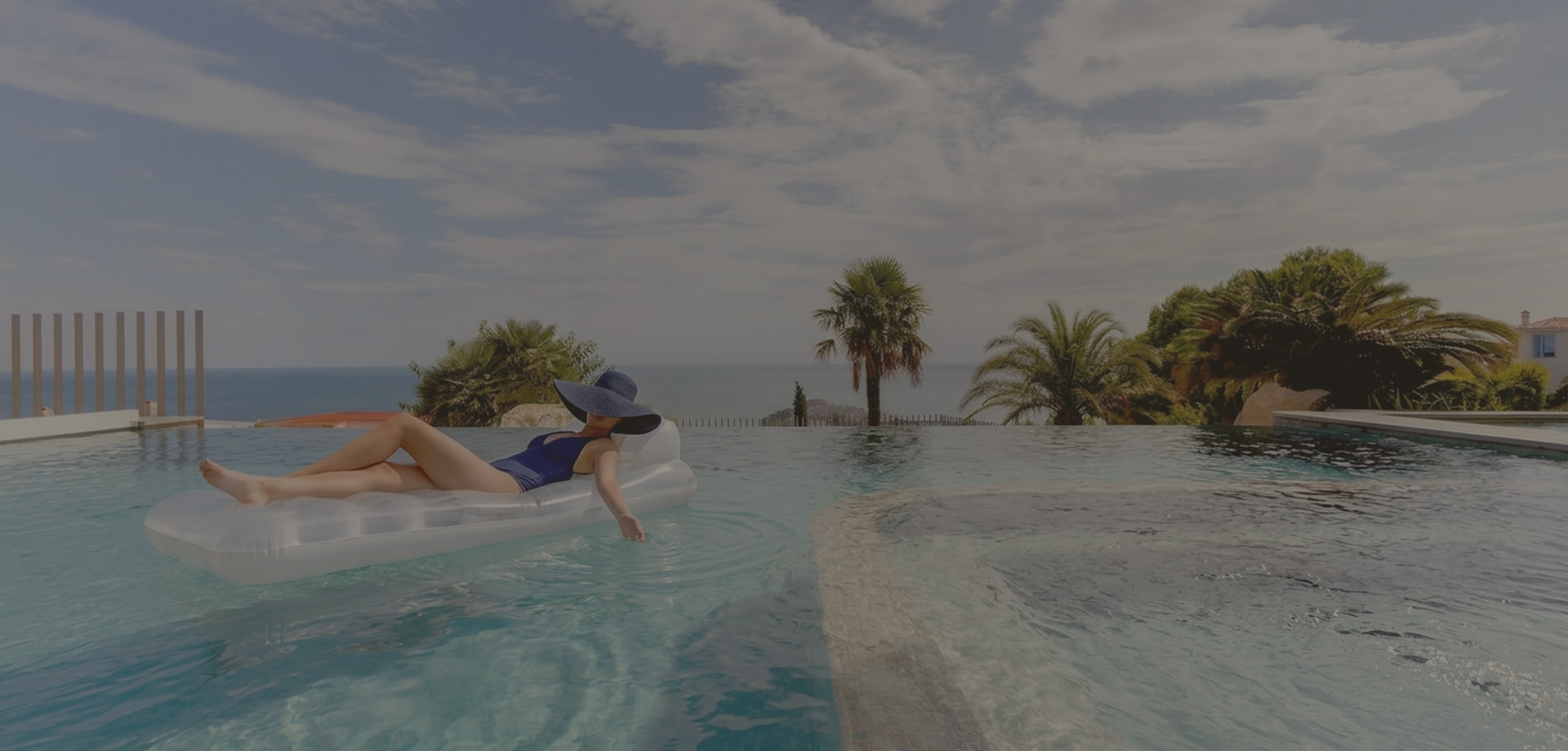 Contact Atalaya Resort Girl on a lilo in the pool