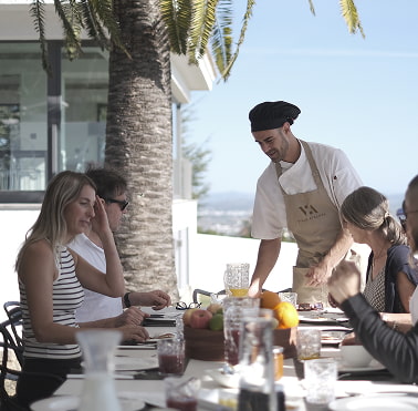 In-house chef Chef serving breakfast at the table