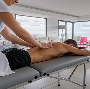 Massage service Massage therapist giving a massage