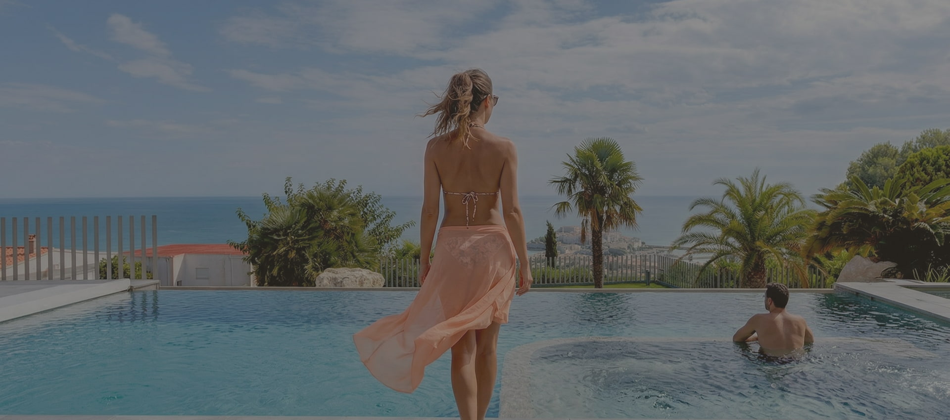 Villa Atalaya: an endless retreat Girl walking towards the pool at Villa Atalaya