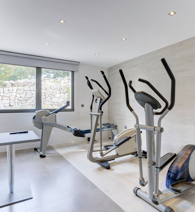 Fitness room Room with gym equipment