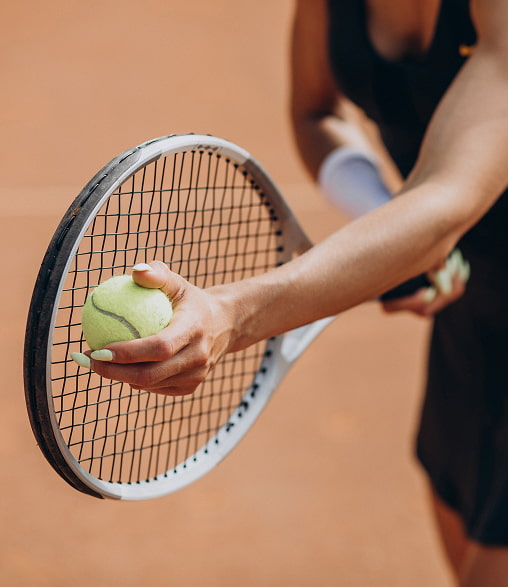 Tennis Hand holding a tennis racket and ball